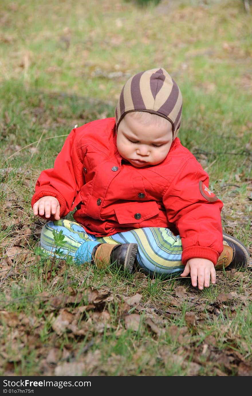 Little serious boy on walk