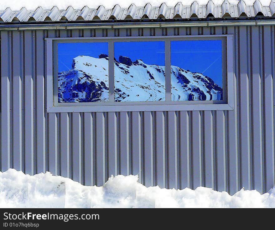 Station of cableway in mirror effect in austrian alpes