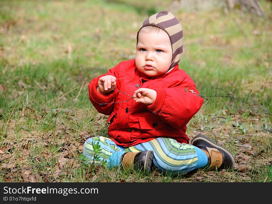 Little serious boy on walk