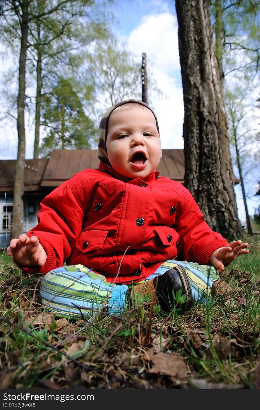 Portrait of adorable baby boy playing on the street. Portrait of adorable baby boy playing on the street