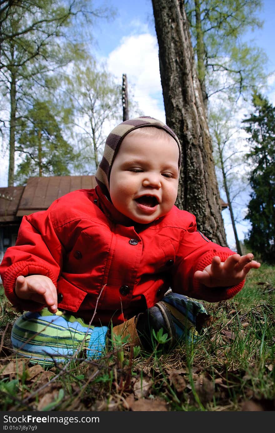 Portrait of adorable baby boy playing on the street. Portrait of adorable baby boy playing on the street