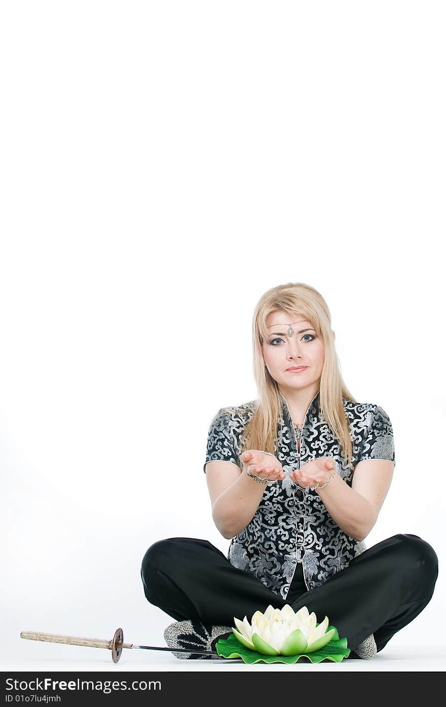 Woman Meditating In Lotus Pose