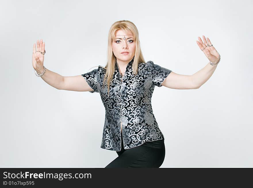 Beautiful woman exercising, studio shot