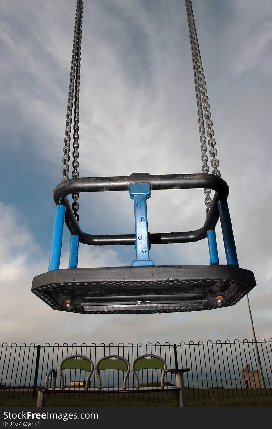 Playground swing at the seaside resort of ballybunion ireland in winter. Playground swing at the seaside resort of ballybunion ireland in winter