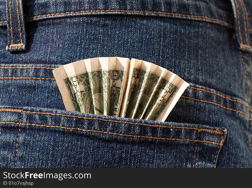 Cash one dollar in the blue Jeans pocket. Cash one dollar in the blue Jeans pocket