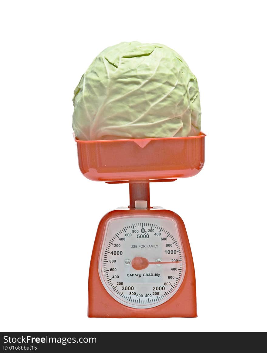 Red kitchen scale weighting cabbage