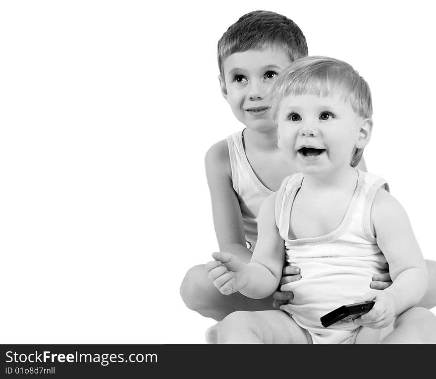 Two boys in identical clothes look in the chamber. Two boys in identical clothes look in the chamber