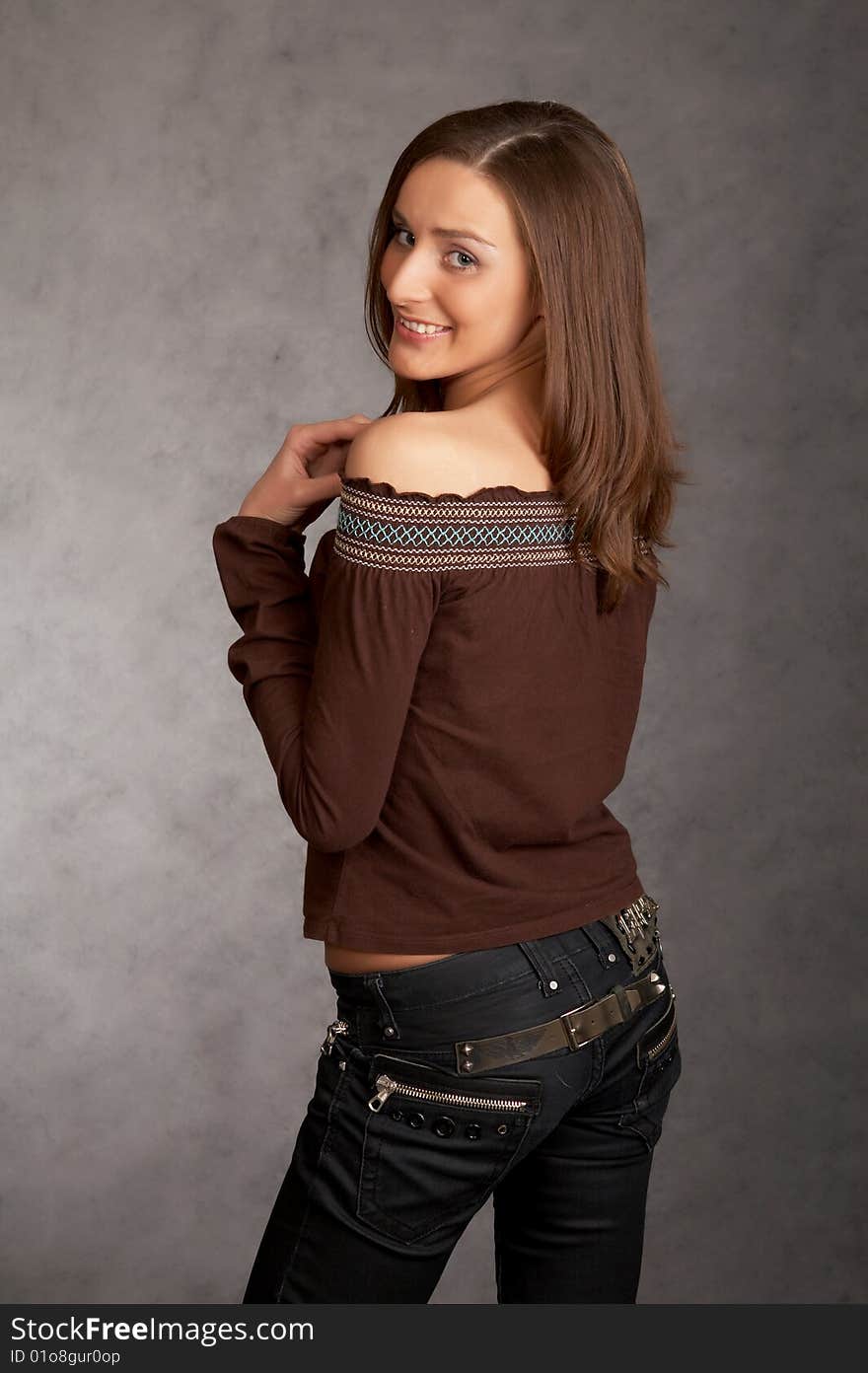 Sexy woman on a dark background in a studio