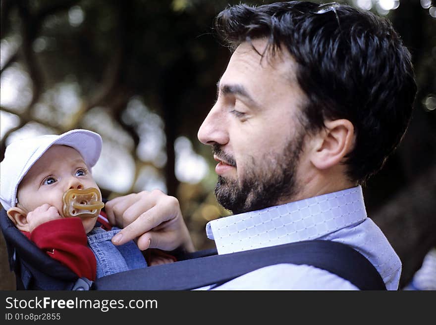 Father and son in a park. Father and son in a park