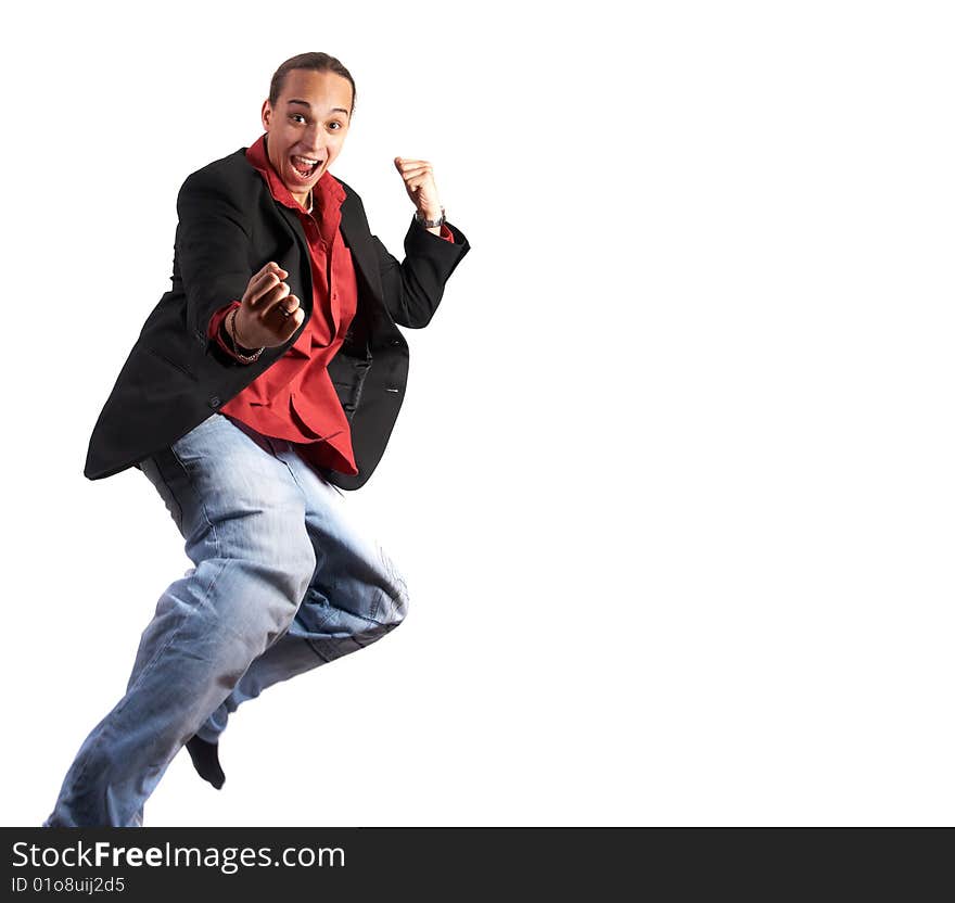 A young businessman with a red shirt, a jacket and blue jeans is jumping in joy. Isolated over white. Slight motion bluriness is intended. A young businessman with a red shirt, a jacket and blue jeans is jumping in joy. Isolated over white. Slight motion bluriness is intended.