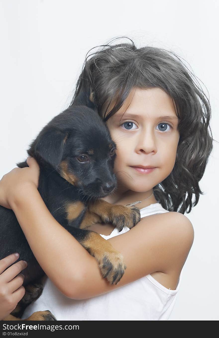 Portrait of little girl having good time with her puppy. Portrait of little girl having good time with her puppy