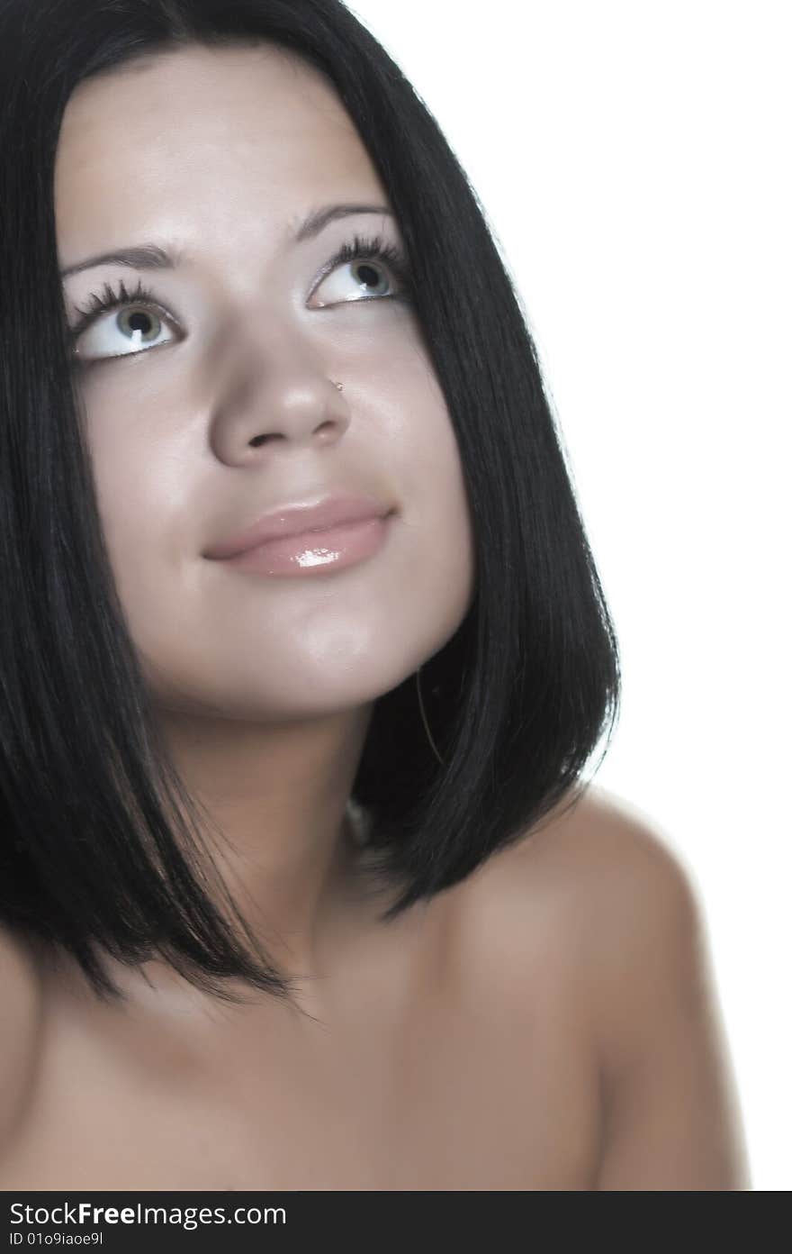 Portrait of young beautiful woman with dark hair.