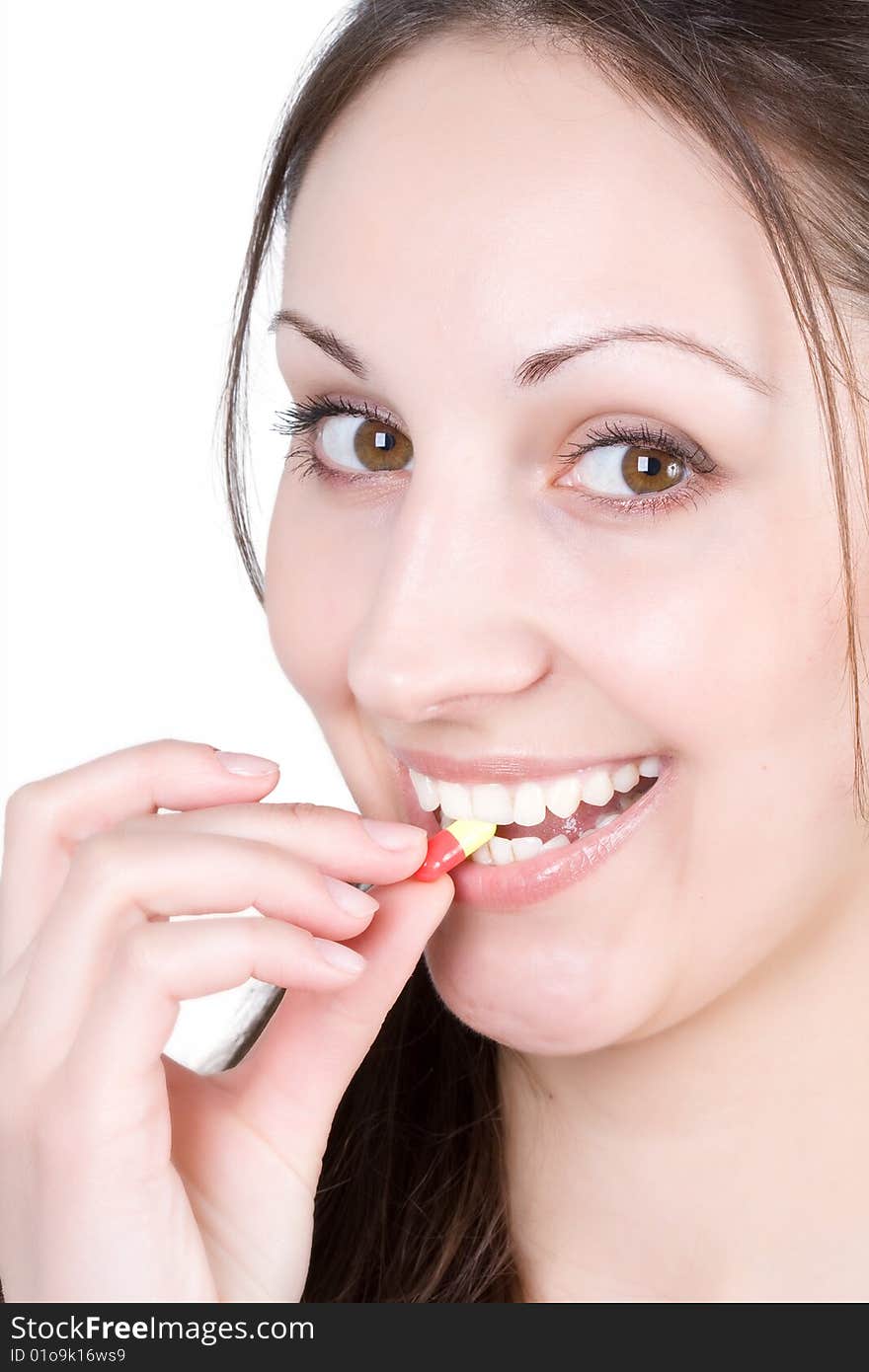 Woman taking pill on a white background