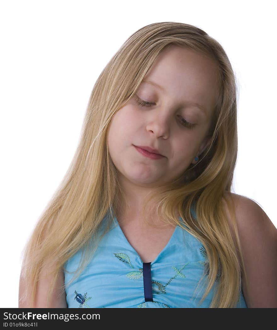 Melancholy girl in a blue dress isolated on a white background