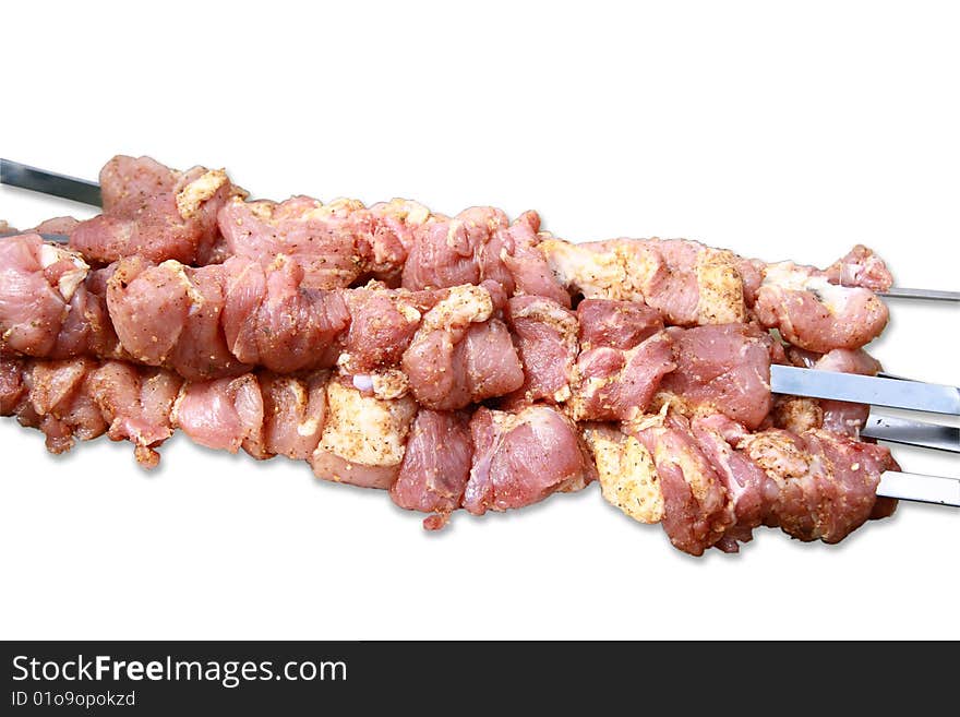 Pieces of raw meat ready to be grilled on the barbecue. Pieces of raw meat ready to be grilled on the barbecue