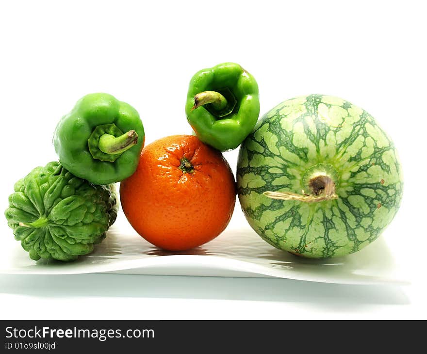 Vegetable on whtie plate isolated on white background. Vegetable on whtie plate isolated on white background.