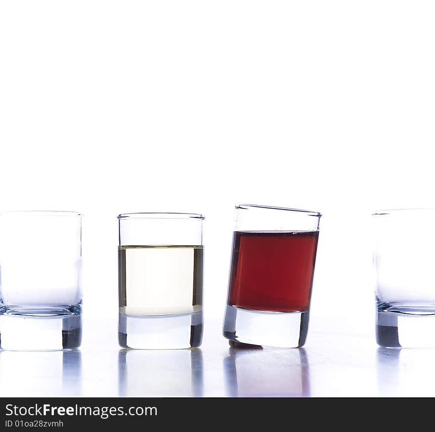 Closeup of glasses for alcoholic drinks. Isolated over white background