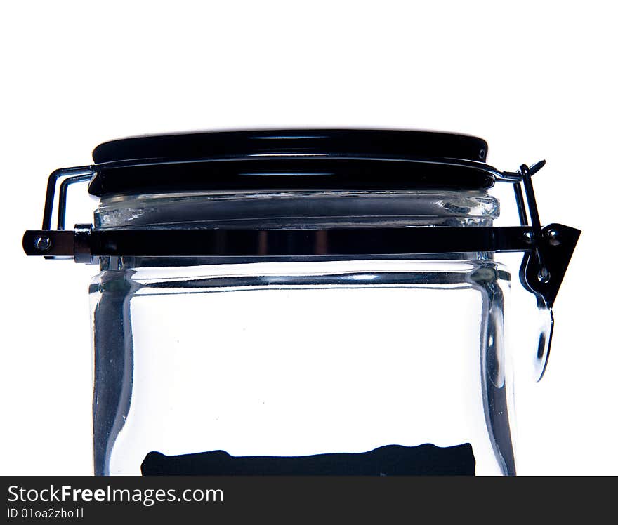 Close-up of transparent glass jar. Isolated over white