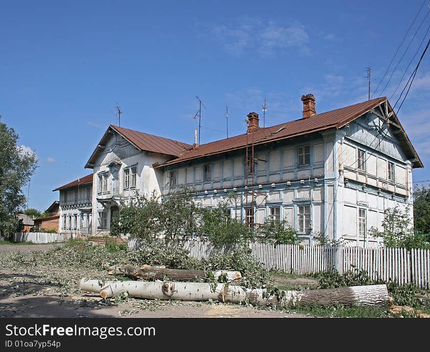 Old building and cutted tree