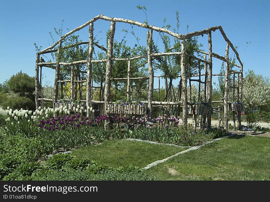 Log shaped open structure with flowers. Log shaped open structure with flowers