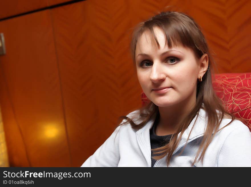 The young woman poses in a hotel