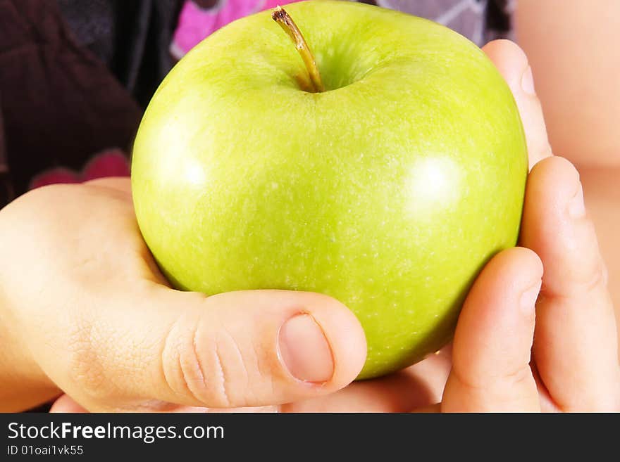 Green Apple on woman hand. Food image