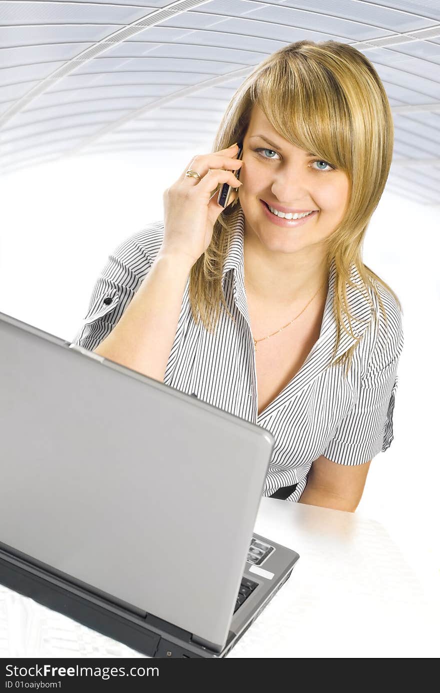 Young business woman talking on phone