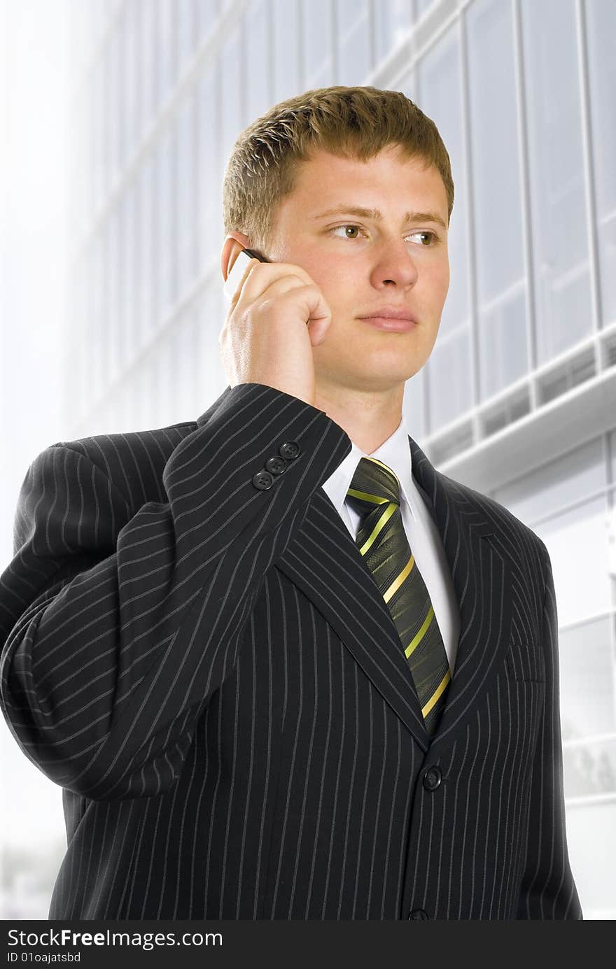 Young business man talking on phone