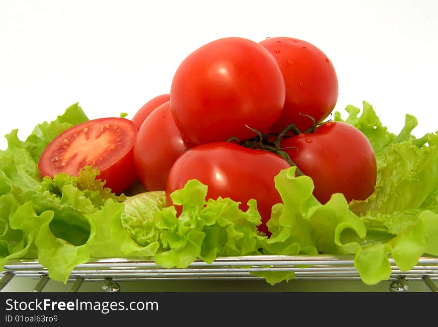 Ripe tomatoes, lettuce and glass of tomato juice