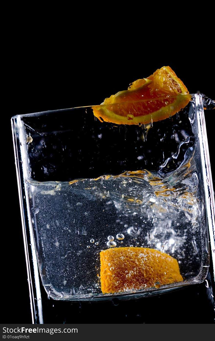 Close up view of the orange splash in water. Close up view of the orange splash in water