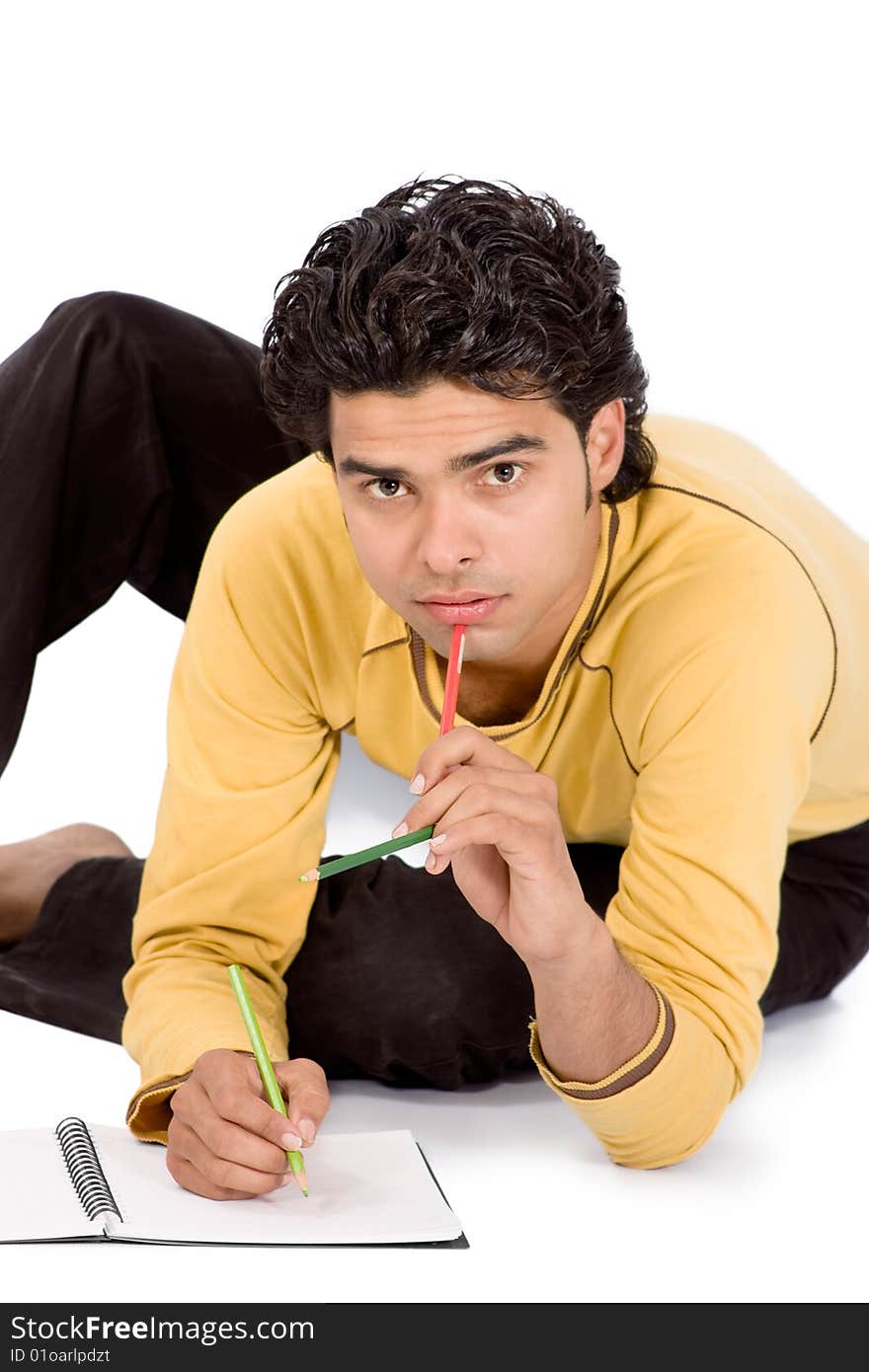 Man on white background writing something on dairy with colorful pencil. Man on white background writing something on dairy with colorful pencil