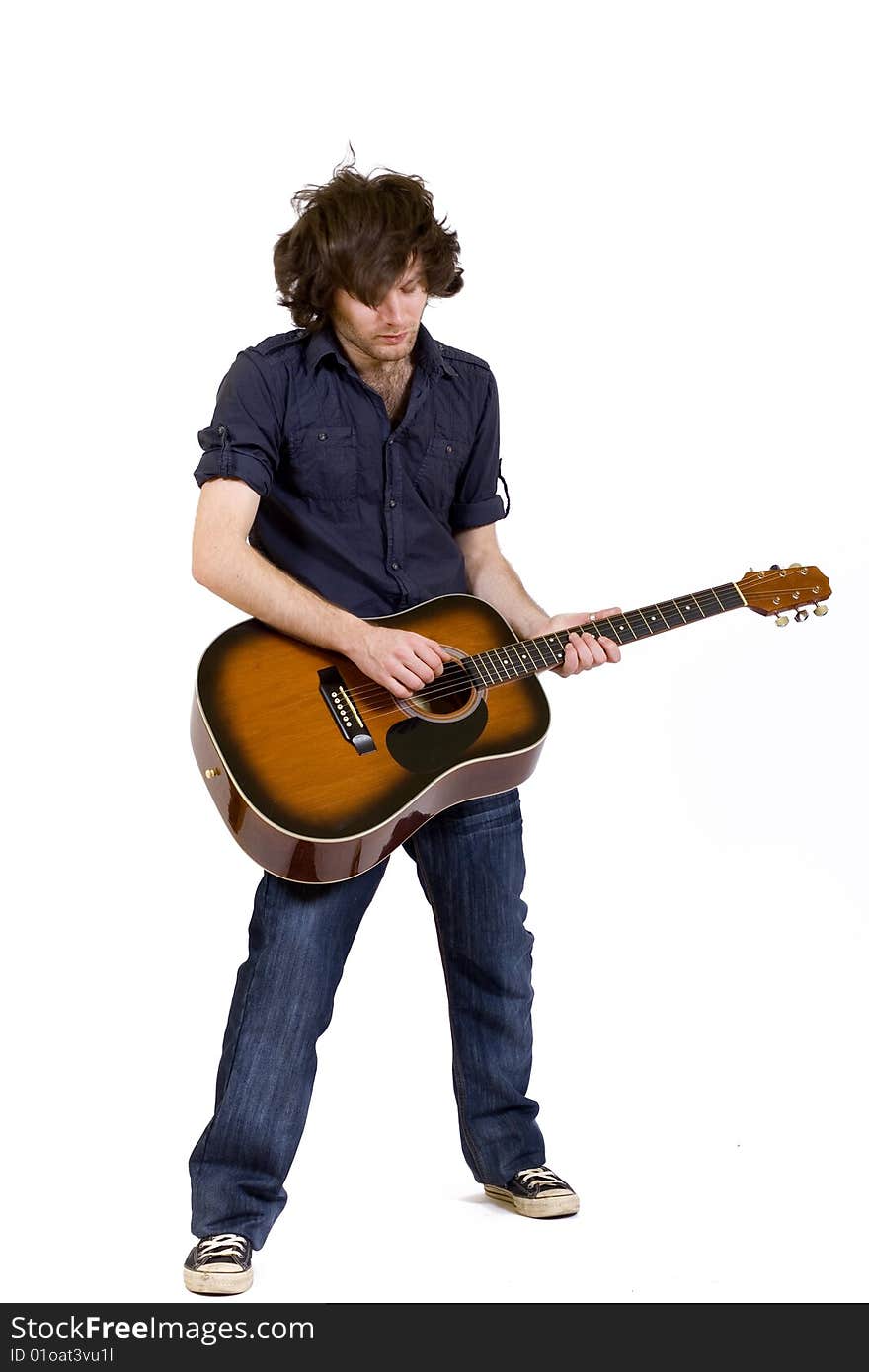 Headbanging Guitarist Playing An Acoustic Guitar