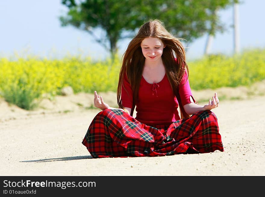 Girl with long hair on country road