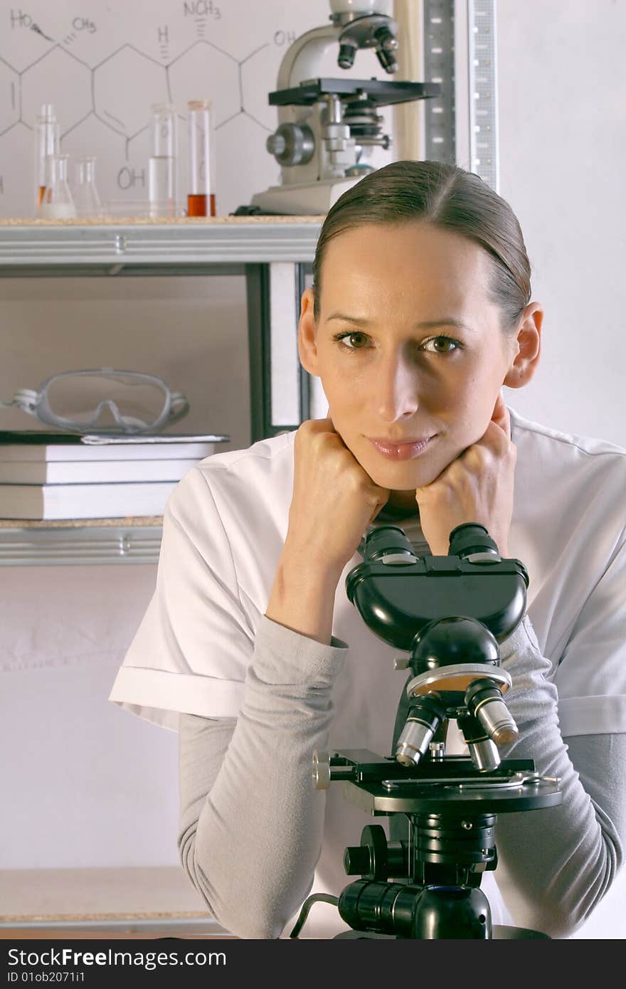 Scientist with microscope