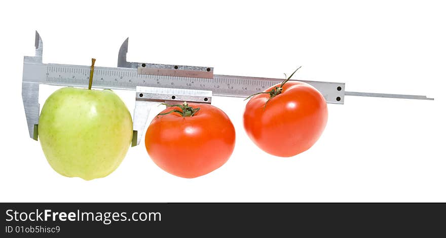 Trimmel with apple and tomato isolated on white. Clipping paths