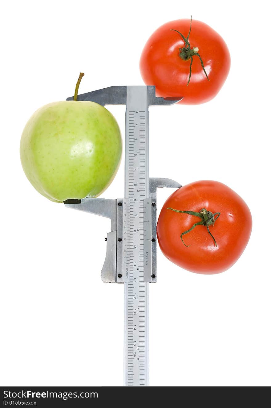 Trimmel with apple and tomato isolated on white. Clipping paths