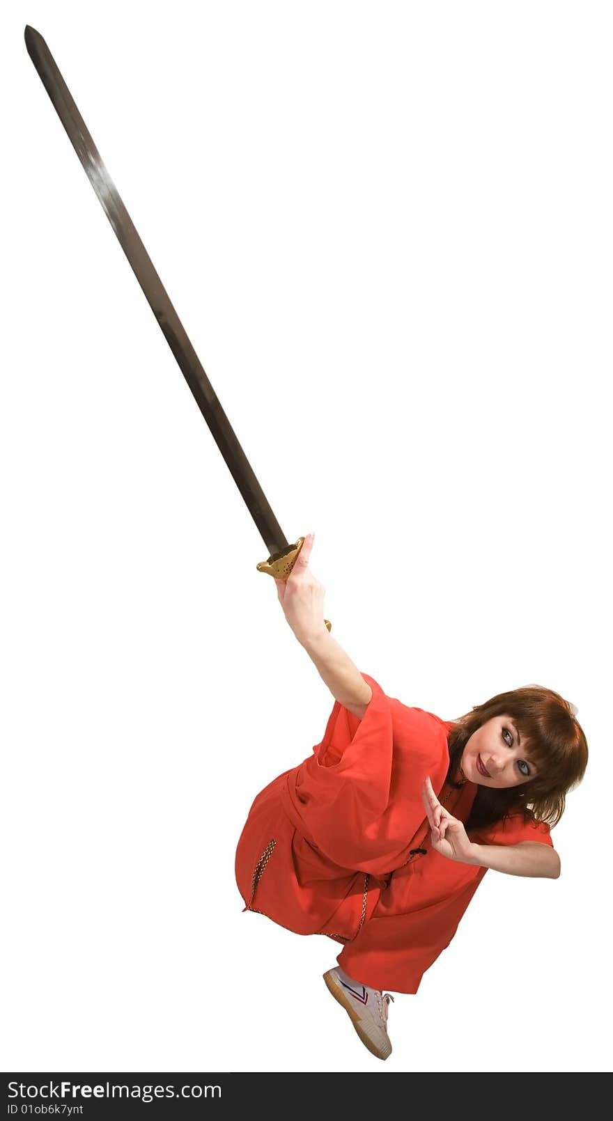 Young woman makes kung-fu exercise with sword isolated with clipping path on white background. Young woman makes kung-fu exercise with sword isolated with clipping path on white background