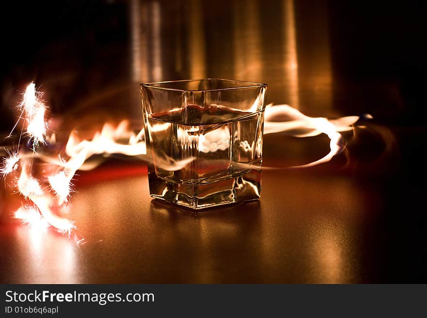 Glass with water between the flames. Glass with water between the flames
