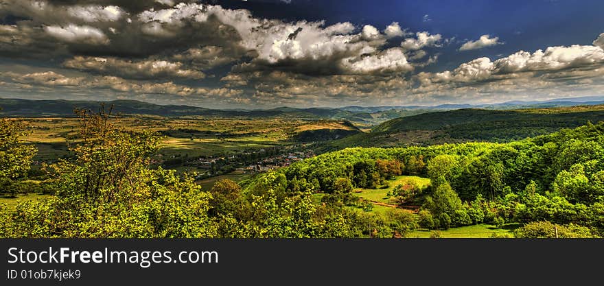 A view of the Carpathian mountains ahead from the top of a  hill. A view of the Carpathian mountains ahead from the top of a  hill.