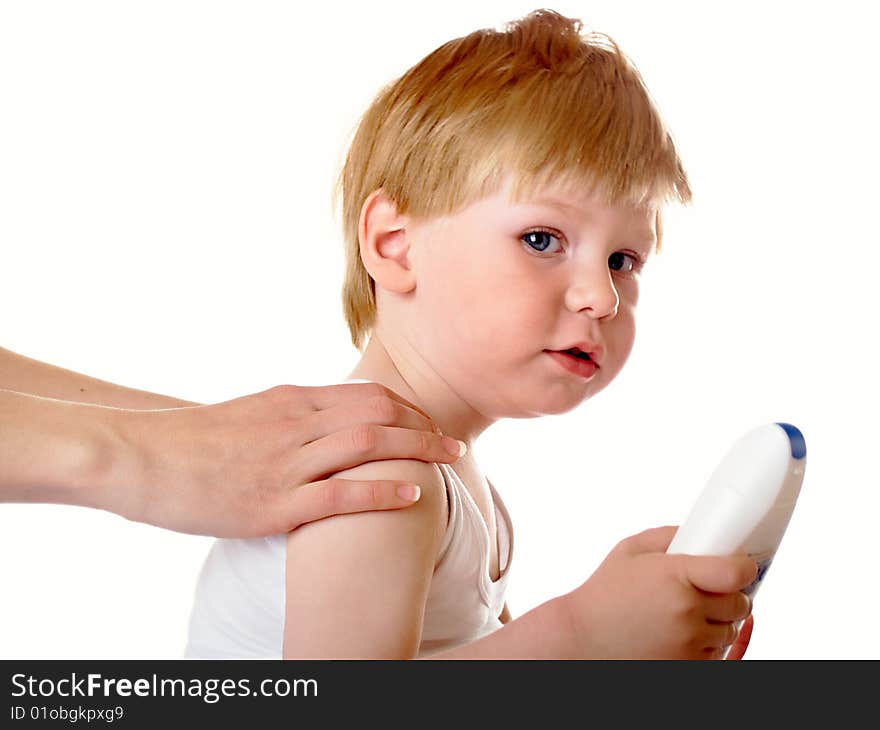 Massage to the small child in a white room. Massage to the small child in a white room