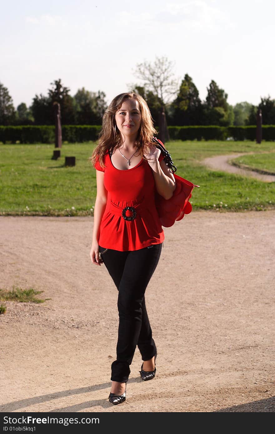 A young girl walking outdoor. A young girl walking outdoor