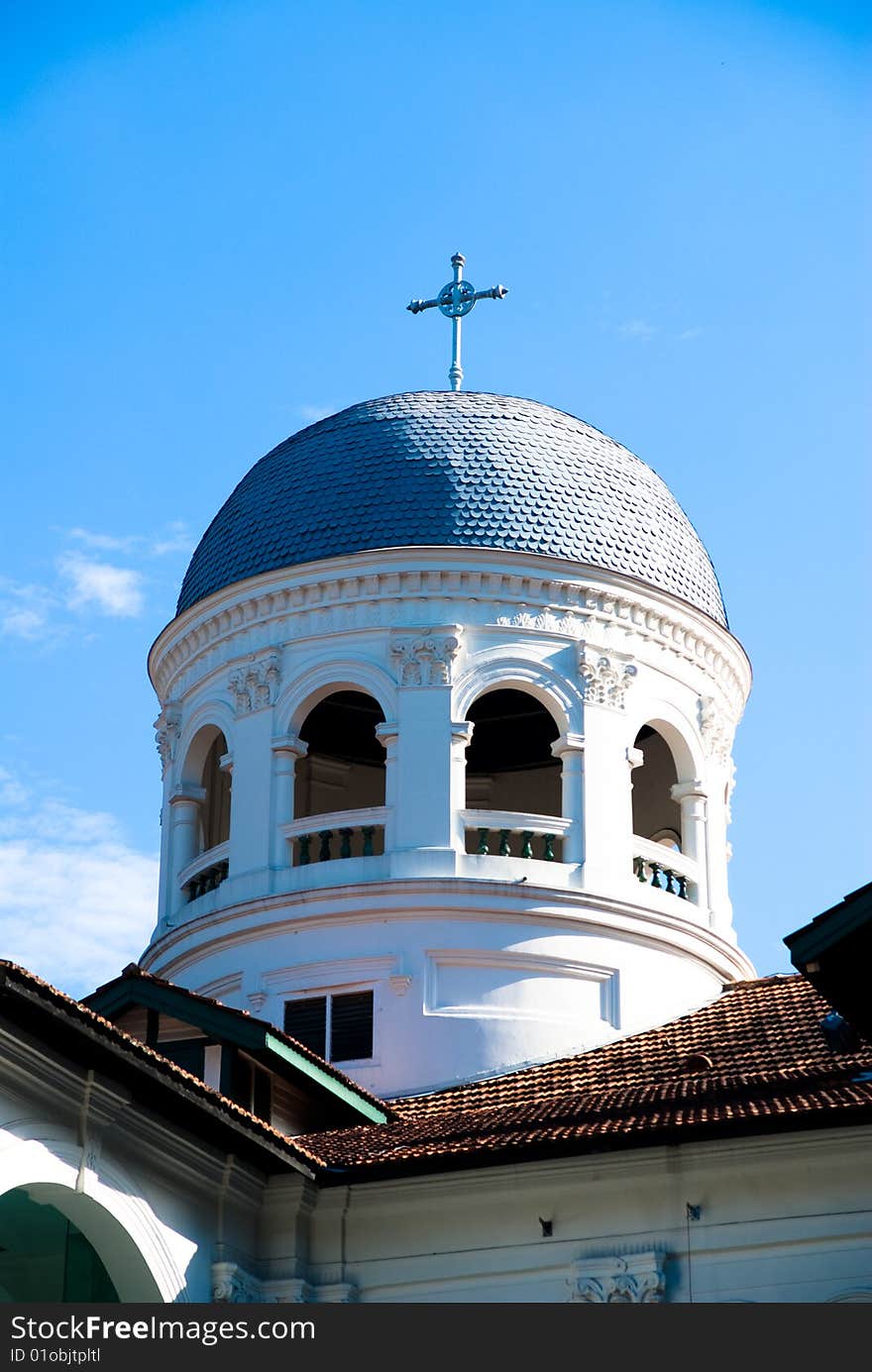 White church roof exterior against blue sky