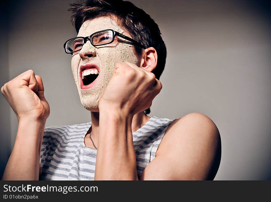 Close-up portrait of funny man with facial mask and glasses. Close-up portrait of funny man with facial mask and glasses