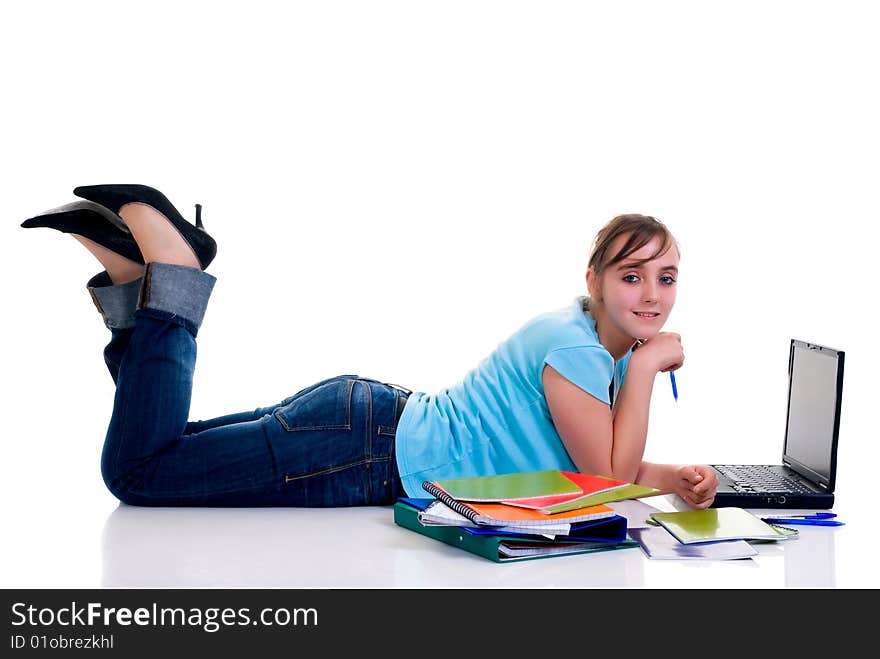 Teenager schoolgirl with laptop on white background