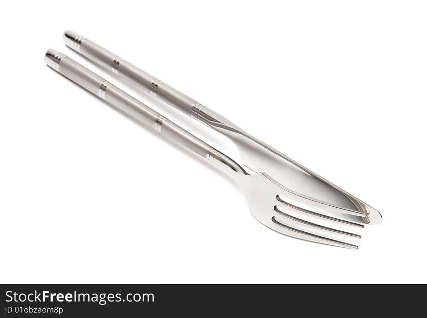 Steel knife and fork on a white background