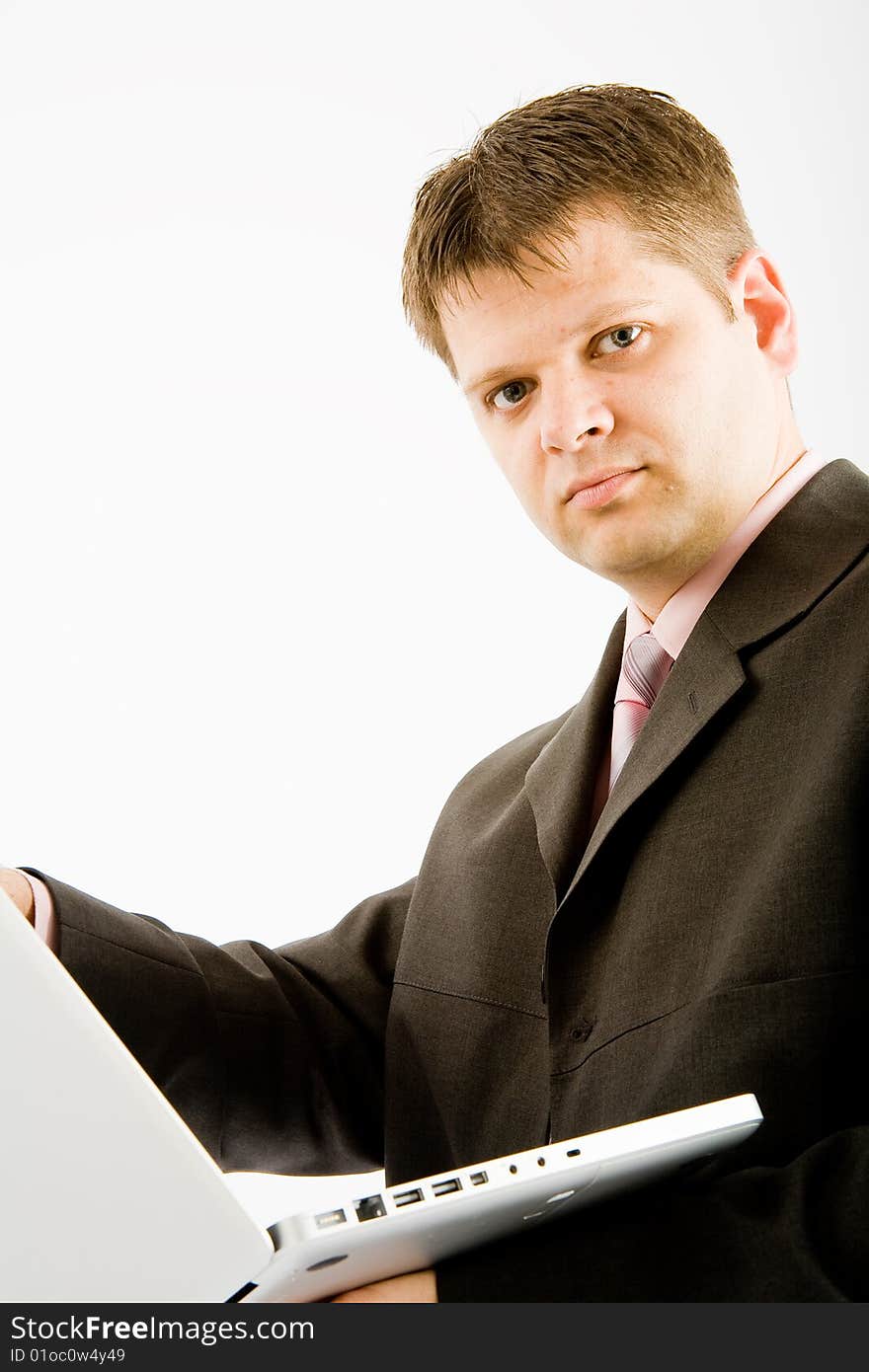 Young business man with laptop computer on white background