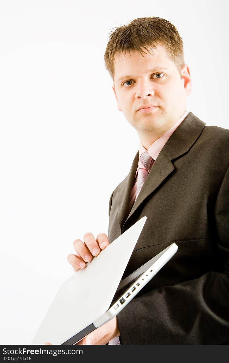 Young business man with laptop computer on white background