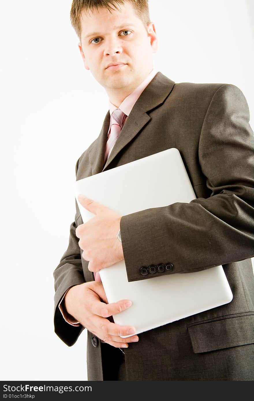 Young business man with laptop computer on white background