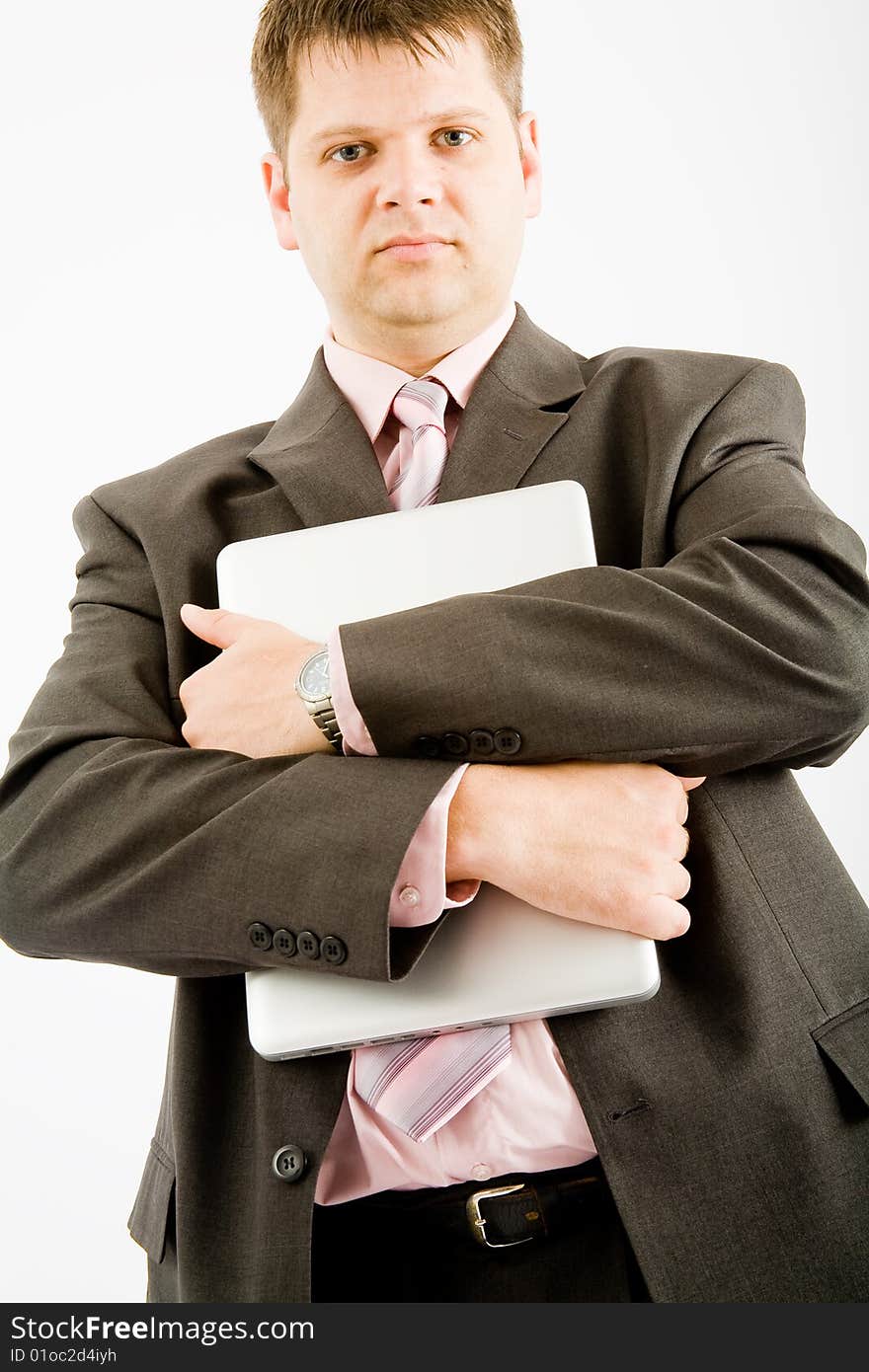 Young business man with laptop computer on white background