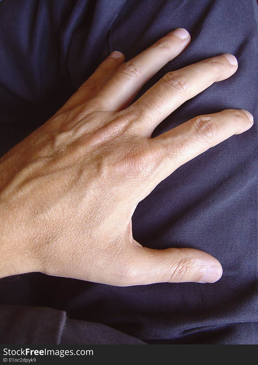 Close up view of a hand on a pants. Close up view of a hand on a pants